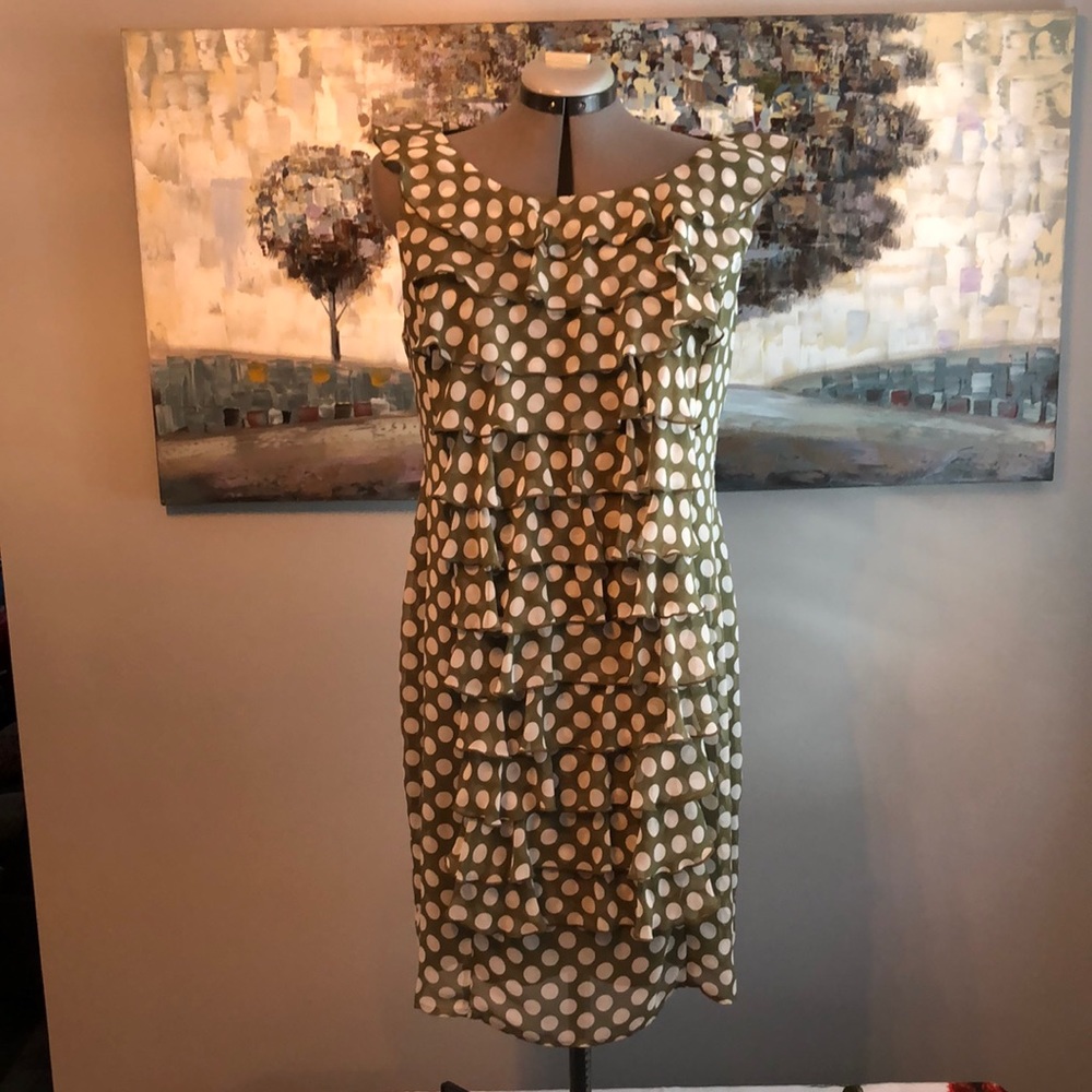 Moss green with white polka dots and front ruffles. Fabulous and fun dress!